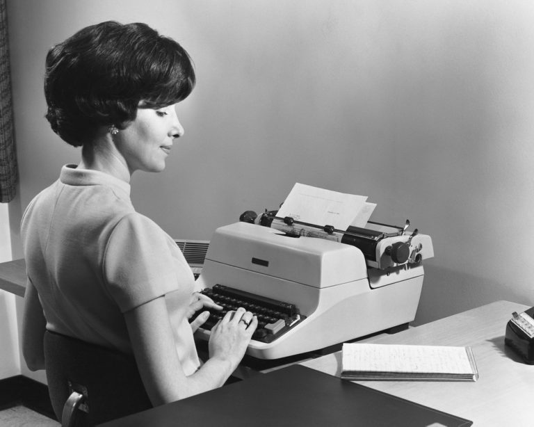 vintage photo of secretary sitting down